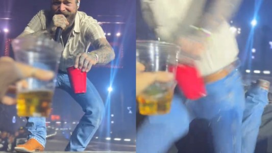 Post Malone quiso brindar con una fan en un show, pero pisó mal y se cayó del escenario